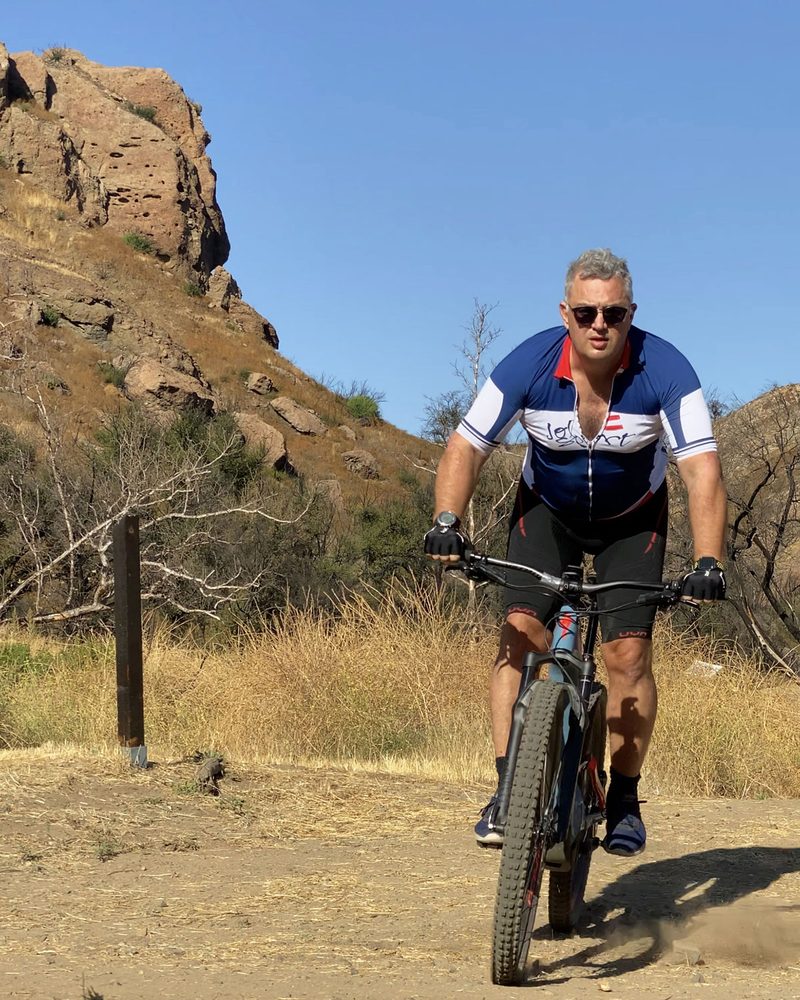 Mario Engel riding a mountain bike through the California landscape